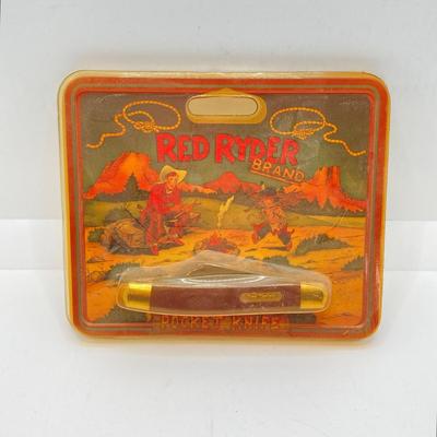 LOT 74: Collection of Red Ryder Memorabilia - Pocket Knives, Limited Edition Belt Buckle, Pocket Watch and More