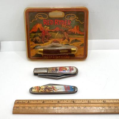 LOT 74: Collection of Red Ryder Memorabilia - Pocket Knives, Limited Edition Belt Buckle, Pocket Watch and More