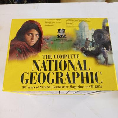LOT 126: National Geographic 1975 Atlas of the World, On Assignment Board Game & Magazines on CD-ROM