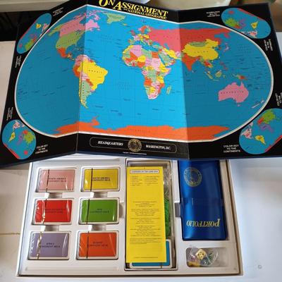 LOT 126: National Geographic 1975 Atlas of the World, On Assignment Board Game & Magazines on CD-ROM