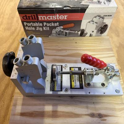 LOT:: 150 - Drill Master Portable Pocket Hole Jig Kit, Craftsman Angle Gringer, & Dovetail Templates