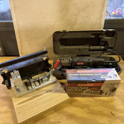 LOT:: 150 - Drill Master Portable Pocket Hole Jig Kit, Craftsman Angle Gringer, & Dovetail Templates