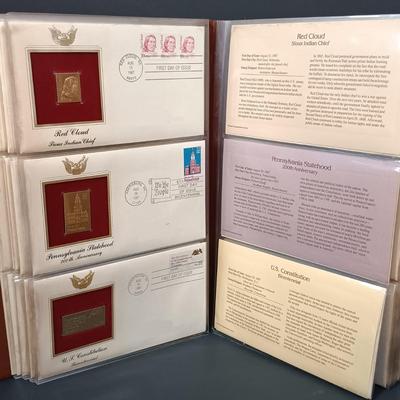 LOT 158: Postal Commemorative Society 22kt Gold Proof Replicas of US Stamps (14 Pages)