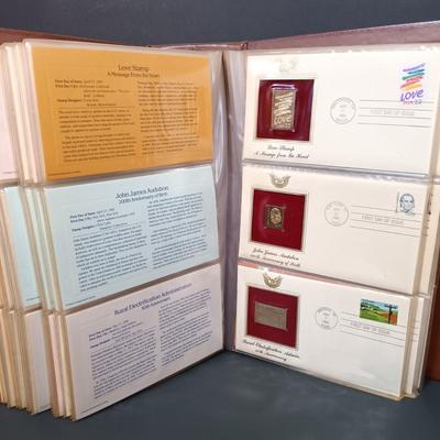 LOT 159: Postal Commemorative Society 22kt Gold Proof Replicas of US Stamps (24 Pages)