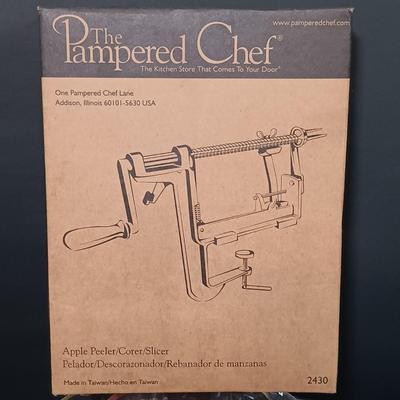 LOT 165: The Pampered Chef Apple Peeler and Prep Bowls with Nantucket Pie Plate, Fire King Measuring Cup & More