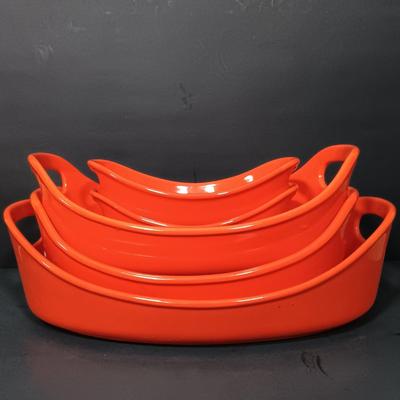 LOT 166: Rachel Ray Orange Casserole Dishes and Red Mixing Bowls with Cordon Bleu Platter
