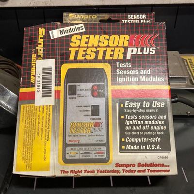 LOT 244: Garage Cabinet Finds - Portable Battery Tester, Sensor Tester Plus, Sears Craftsman Timing Light and More