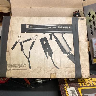 LOT 244: Garage Cabinet Finds - Portable Battery Tester, Sensor Tester Plus, Sears Craftsman Timing Light and More