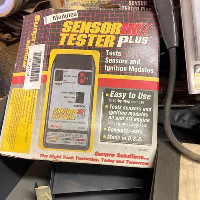 LOT 244: Garage Cabinet Finds - Portable Battery Tester, Sensor Tester Plus, Sears Craftsman Timing Light and More