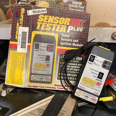 LOT 244: Garage Cabinet Finds - Portable Battery Tester, Sensor Tester Plus, Sears Craftsman Timing Light and More