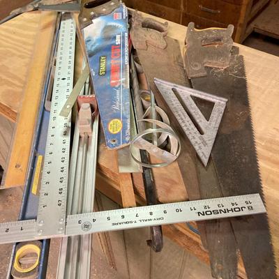 LOT 247: Large Tool Collection - Hammers, Hand Saws, Levels, T-Squares, Rulers and More