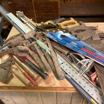 LOT 247: Large Tool Collection - Hammers, Hand Saws, Levels, T-Squares, Rulers and More
