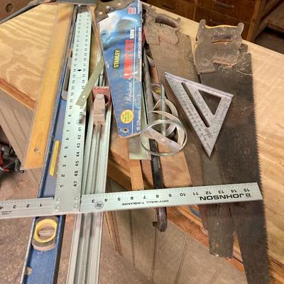 LOT 247: Large Tool Collection - Hammers, Hand Saws, Levels, T-Squares, Rulers and More