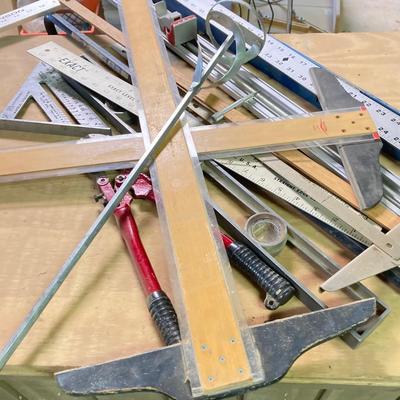 LOT 247: Large Tool Collection - Hammers, Hand Saws, Levels, T-Squares, Rulers and More