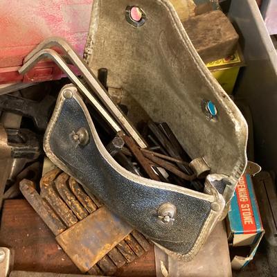 LOT 252: Garage Cabinet Finds - Gasket Hole Punch Set, Butt Chisels, Hollow Punch Set, Sharpening Stones and More