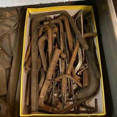 LOT 252: Garage Cabinet Finds - Gasket Hole Punch Set, Butt Chisels, Hollow Punch Set, Sharpening Stones and More