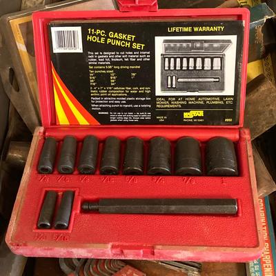 LOT 252: Garage Cabinet Finds - Gasket Hole Punch Set, Butt Chisels, Hollow Punch Set, Sharpening Stones and More