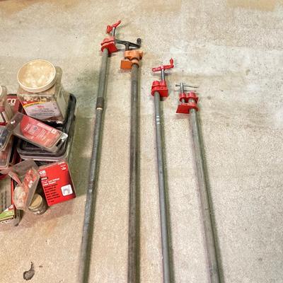 LOT 254: Pipe Clamps, Box of Grip Rite Framing Nails, Plastic Staples, Wing Guards, Hardware and More