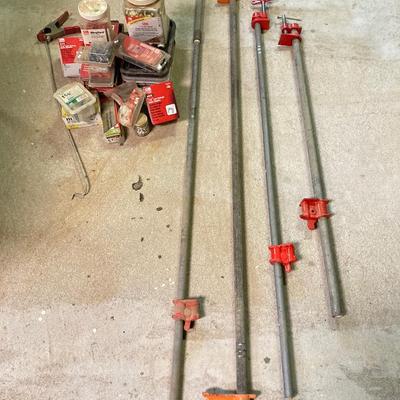 LOT 254: Pipe Clamps, Box of Grip Rite Framing Nails, Plastic Staples, Wing Guards, Hardware and More