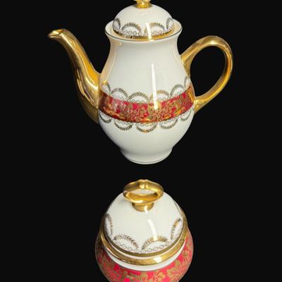 Sale Photo Thumbnail #220: Service for two.  Teapot, sugar bowl, tea cups, and saucers.  [RE]