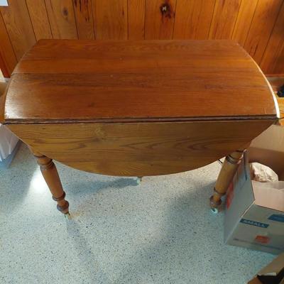 Sale Photo Thumbnail #67: A great all wood table with both sides are a drop leaf it is also on wheels.  Dimensions open are 29" tall 50" length & 42" width