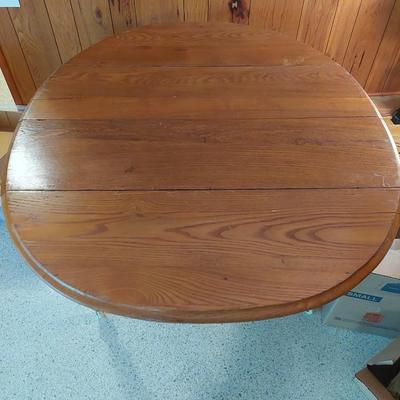 Sale Photo Thumbnail #65: A great all wood table with both sides are a drop leaf it is also on wheels.  Dimensions open are 29" tall 50" length & 42" width