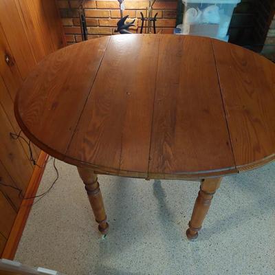 Sale Photo Thumbnail #66: A great all wood table with both sides are a drop leaf it is also on wheels.  Dimensions open are 29" tall 50" length & 42" width