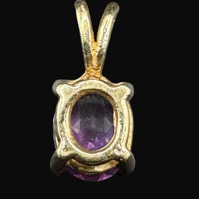 Sale Photo Thumbnail #252: **WIRE TRANSFER IS REQUIRED IF SHIPPED.** [1.26g] This emerald cut amethyst pendant is prong set in yellow gold.  Approximately 2.5 carat amethyst. **ALL PRECIOUS METALS SALES ARE FINAL. NO REFUNDS WILL BE GIVEN FOR ANY REASON.** [KB]