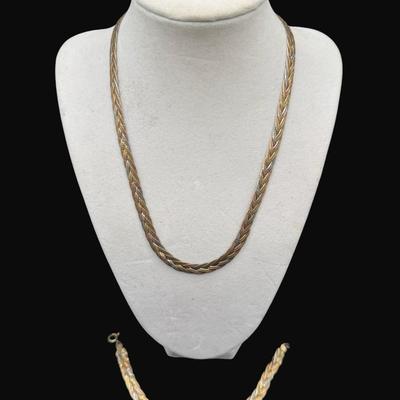 Sale Photo Thumbnail #261: **WIRE TRANSFER IS REQUIRED IF SHIPPED.** [23.16g] This ensemble features a bi-color herringbone style necklace with matching bracelet. Marked “925, Italy.” The necklace is 18"L, and the bracelet is 6.5"L. **ALL PRECIOUS METALS SALES ARE FINAL. NO REF
