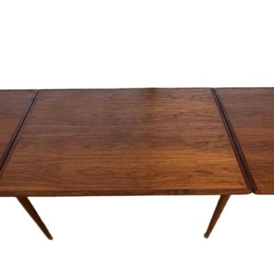Sale Photo Thumbnail #276: H. Sigh & Son dining table with two hidden leaves. Teak construction. The table functions as it should. The table top can be removed. Age related wear. Closed dimensions: 49"L x 33.5"W.  Open or extended: 90"L x 33.5"W. [CS]