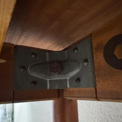 Sale Photo Thumbnail #278: H. Sigh & Son dining table with two hidden leaves. Teak construction. The table functions as it should. The table top can be removed. Age related wear. Closed dimensions: 49"L x 33.5"W.  Open or extended: 90"L x 33.5"W. [CS]