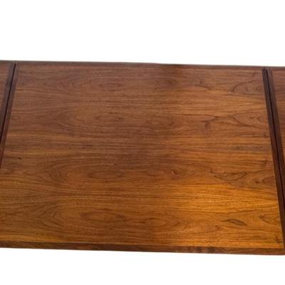 Sale Photo Thumbnail #277: H. Sigh & Son dining table with two hidden leaves. Teak construction. The table functions as it should. The table top can be removed. Age related wear. Closed dimensions: 49"L x 33.5"W.  Open or extended: 90"L x 33.5"W. [CS]