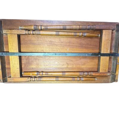 Sale Photo Thumbnail #286: This antique sewing table has a yardstick stamped into the wood. The table may need some minor repair. It opens and closes as expected. Measurement: 36”W. [CS]