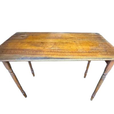 Sale Photo Thumbnail #283: This antique sewing table has a yardstick stamped into the wood. The table may need some minor repair. It opens and closes as expected. Measurement: 36”W. [CS]