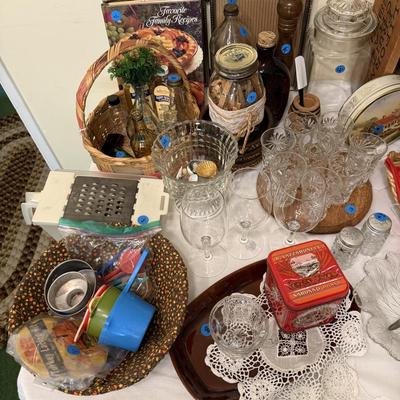 Sale Photo Thumbnail #45: Dishes, tins, glassware, books, custom curtains, mirror, silverware, framed art, etc
****Table, table cloth, plastic shelf, 2 wooden shelves, plate stands not included)****