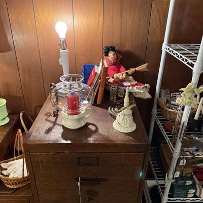 Sale Photo Thumbnail #50: Upholstered chair, lamps, candles, wood file cabinet, metal cabinet, ephemera, dishes, vases, decor, wall paper, ribbon, baskets, mirror,  railroad memorabilia, local advertising items, metal art, records, 8Track, cassettes, etc
****Table, wire shelf, pla