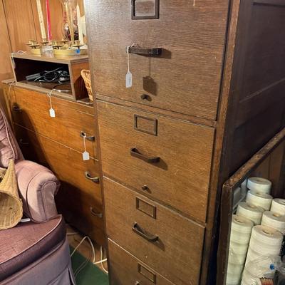 Sale Photo Thumbnail #58: Upholstered chair, lamps, candles, wood file cabinet, metal cabinet, ephemera, dishes, vases, decor, wall paper, ribbon, baskets, mirror,  railroad memorabilia, local advertising items, metal art, records, 8Track, cassettes, etc
****Table, wire shelf, pla