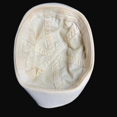 Sale Photo Thumbnail #321: Includes two Korean/Vietnam Era helmets with liners, a USMC flight cap, a USN "Dixie Cup" hat, and a WWII Era Haversack. Total of five pieces. Age related wear. [JP]