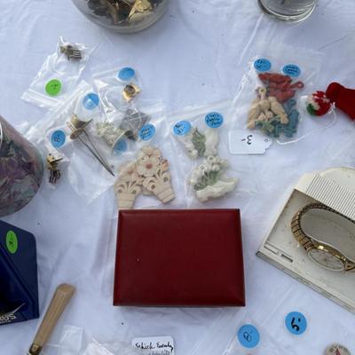 Sale Photo Thumbnail #87: Costume jewelry, watches, advertising pens, collectibles, vases of jewelry,
DOES NOT INCLUDE: table or tablecloth