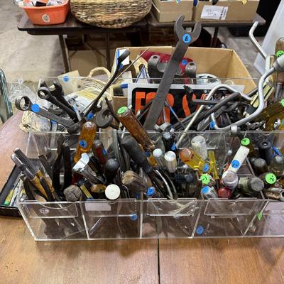 Sale Photo Thumbnail #106: Garage 1: hand tools, hardware supplies, car stuff, electrical, plumbing, cooking, metal shelving, gas ruler, & more
DOES NOT INCLUDE: wooden shelf, plastic sorter, some tin sorting cans
