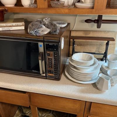 Sale Photo Thumbnail #121: Microwave, dishes, glassware, carafes, milk glass, utensils, home decor, dish drain, bottles, fondue pot, candle stands, etc
DOES NOT INCLUDE 2 plastic shelving, plate stands, plate racks