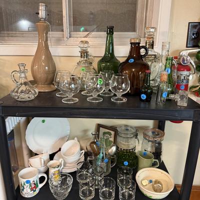 Sale Photo Thumbnail #124: Microwave, dishes, glassware, carafes, milk glass, utensils, home decor, dish drain, bottles, fondue pot, candle stands, etc
DOES NOT INCLUDE 2 plastic shelving, plate stands, plate racks