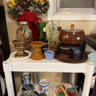 Sale Photo Thumbnail #125: Microwave, dishes, glassware, carafes, milk glass, utensils, home decor, dish drain, bottles, fondue pot, candle stands, etc
DOES NOT INCLUDE 2 plastic shelving, plate stands, plate racks