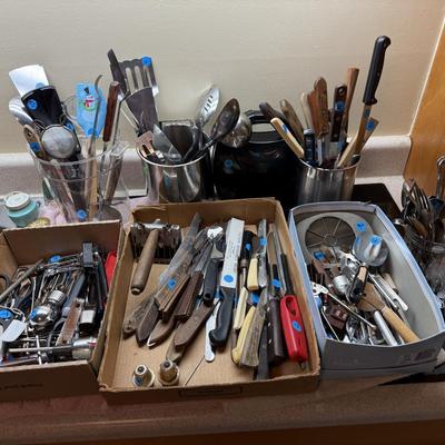 Sale Photo Thumbnail #119: Microwave, dishes, glassware, carafes, milk glass, utensils, home decor, dish drain, bottles, fondue pot, candle stands, etc
DOES NOT INCLUDE 2 plastic shelving, plate stands, plate racks