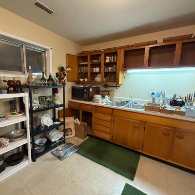 Sale Photo Thumbnail #117: Microwave, dishes, glassware, carafes, milk glass, utensils, home decor, dish drain, bottles, fondue pot, candle stands, etc
DOES NOT INCLUDE 2 plastic shelving, plate stands, plate racks