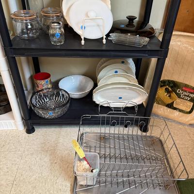 Sale Photo Thumbnail #123: Microwave, dishes, glassware, carafes, milk glass, utensils, home decor, dish drain, bottles, fondue pot, candle stands, etc
DOES NOT INCLUDE 2 plastic shelving, plate stands, plate racks