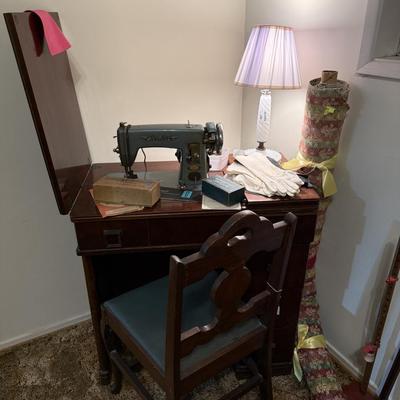 Sale Photo Thumbnail #132: Cavalier sewing machine in cabinet w/chair, lamp, sewing supplies, notions, material, lace, framed artwork 
DOES NOT INCLUDE: table, stacking baskets