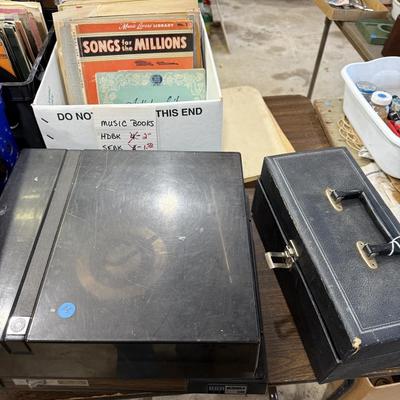 Sale Photo Thumbnail #149: 1st garage middle section
Records, China, coffee table, tow bar, cigar boxes, miscellaneous, toaster oven, card table
DOES NOT INCLUDE: Wooden tables,