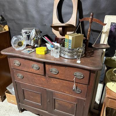Sale Photo Thumbnail #162: Middle garage:
Buffet, dresser, butcher block table top only, chair, mirror, books, lamp, hairdryer, glassware, rolling trashcan, Electrolux parts, etc