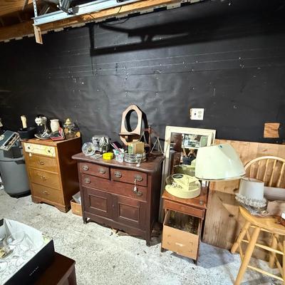 Sale Photo Thumbnail #159: Middle garage:
Buffet, dresser, butcher block table top only, chair, mirror, books, lamp, hairdryer, glassware, rolling trashcan, Electrolux parts, etc